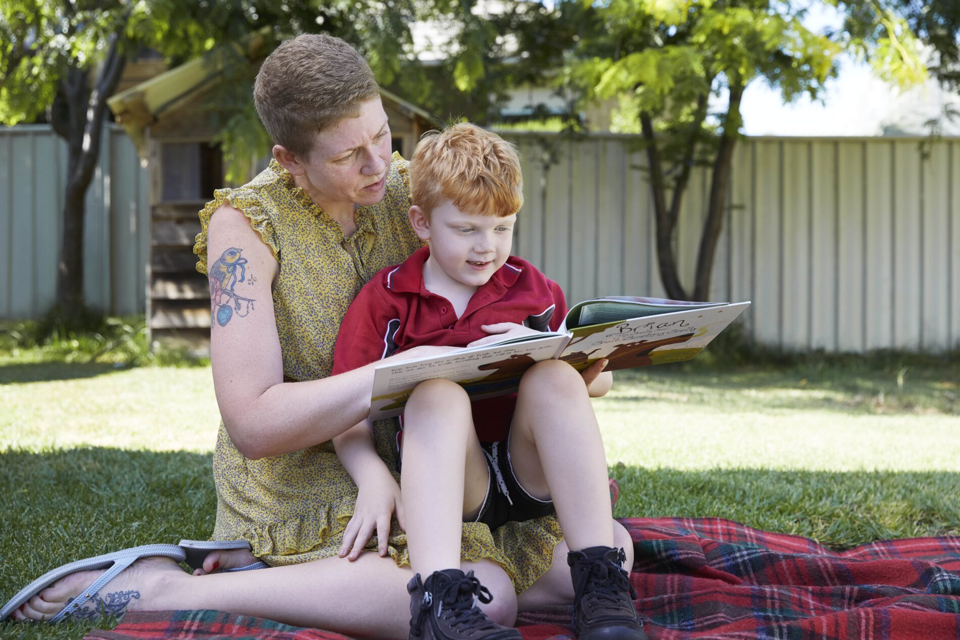 Image of a mother reading a story to her son