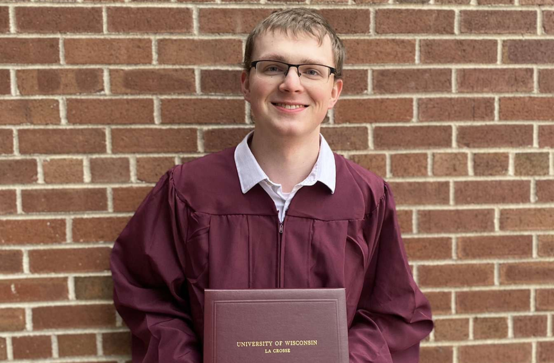 RARE Scholars program alum Josh Eckerman with his college diploma