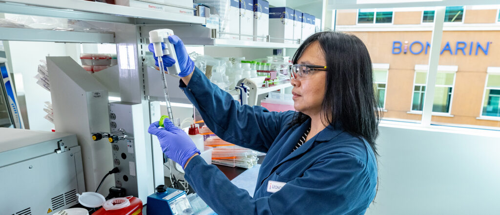 BioMarin scientist pipetting in a lab