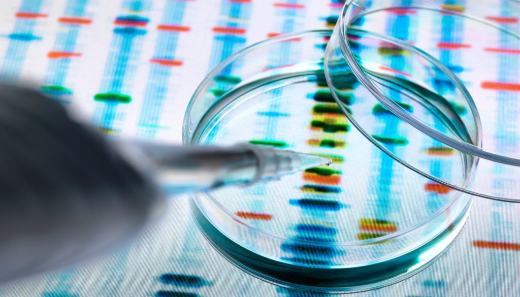 Pipette and petri dish on top of genetic screening results