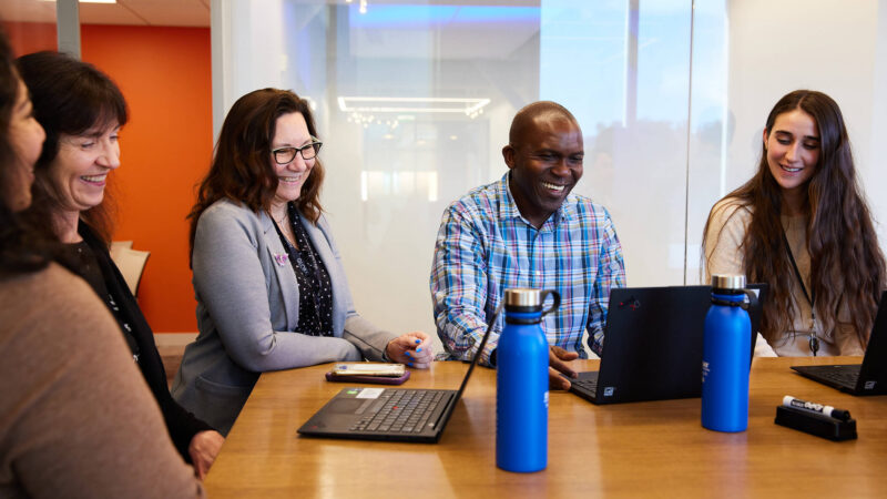 image of group of employees in a meeting room
